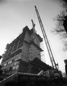 Crane lifting staircase carriageways into a new office building, Sheffield, South Yorkshire, 1961. Creator: Michael Walters