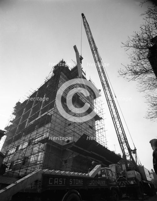 Crane lifting staircase carriageways into a new office building, Sheffield, South Yorkshire, 1961. Artist: Michael Walters