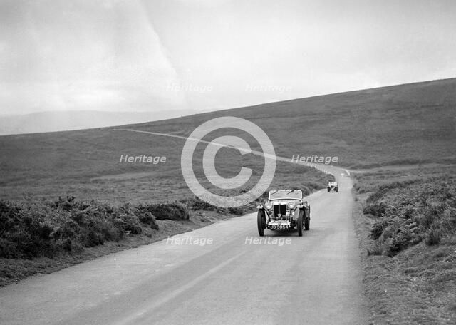 Cream Cracker Team MG PA of JA Bastock competing at the MCC Torquay Rally, July 1937. Artist: Bill Brunell.