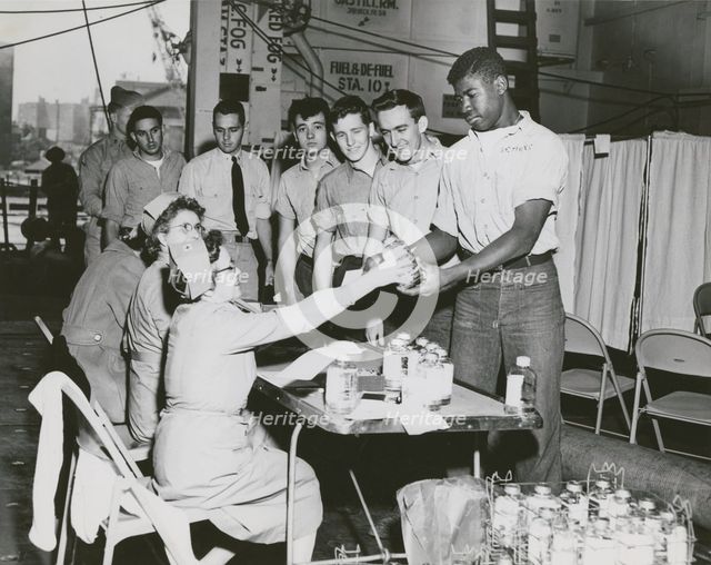 Crew members of the USS Lake Champlain (CVA-39) participating in the ship's two day..., 1950s.  Creator: United States Navy.