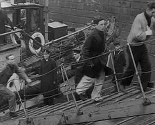Crew of the Destroyed Bismarck Walking up a Gangplank Into a British Ship, 1943. Creator: British Pathe Ltd