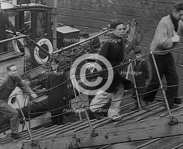 Crew of the Destroyed Bismarck Walking up a Gangplank Into a British Ship, 1943. Creator: British Pathe Ltd.