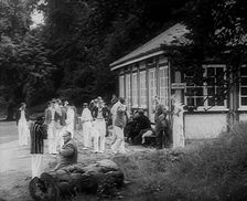 Cricket Players Relaxing Outside, 1940. Creator: British Pathe Ltd