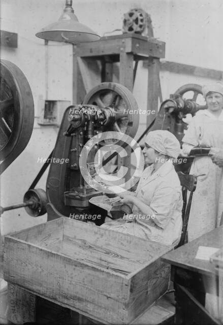 Crimping ignition tubes, between c1915 and c1920. Creator: Bain News Service.