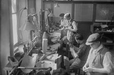 Cripples making artificial limbs, between c1915 and c1920. Creator: Bain News Service