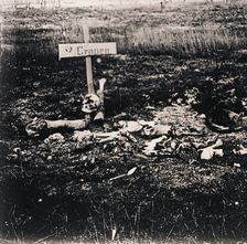 Cross and human remains, c1914-c1918