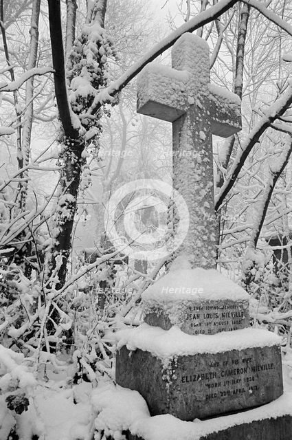 Cross on a grave in Highgate Cemetery, Hampstead, London, c1980-c1984. Artist: John Gay.