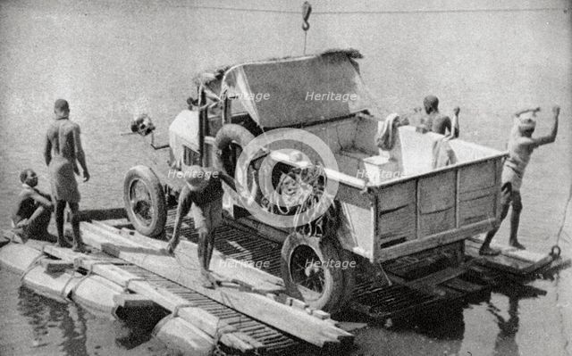 Crossing the Chambesi River on a broken pontoon, Northern Rhodesia, 1925 (1927). Artist: Thomas A Glover