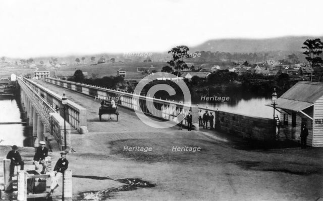 Crossing the first permanent Victoria Bridge, Brisbane, c1874. Creator: Unknown.