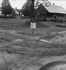 Crossroads hamlet after a rain, Culbreth, Granville County, North Carolina, 1939. Creator: Dorothea Lange