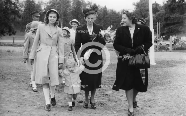 Crown Prince Carl Gustav with mother Sibylla and big sister Margaretha, Stockholm, 1947.  Creator: Unknown.