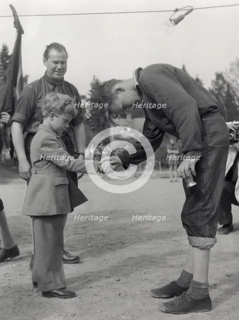 Crown Prince Carl Gustaf of Sweden at a prize-giving ceremony, Stockholm, Sweden, 1953. Creator: Unknown.