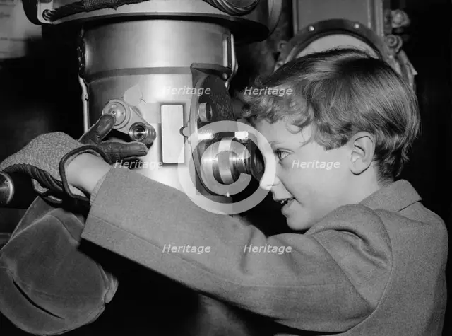 Crown Prince Carl Gustaf of Sweden on a submarine at an exhibition, Stockholm, Sweden, 1956. Creator: Unknown.