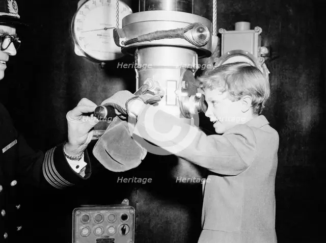 Crown Prince Carl Gustaf of Sweden on a submarine at an exhibition, Stockholm, Sweden, 1956. Creator: Unknown.