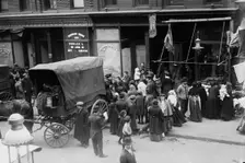 Crowd gathered in front of butcher shop during meat riot, New York, 1910. Creator: Bain News Service