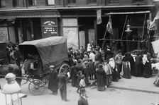 Crowd gathered in front of butcher shop during meat riot, New York, 1910. Creator: Bain News Service