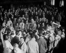 Crowd of Civilians Buying and Selling Stocks and Shares, 1932. Creator: British Pathe Ltd