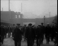 Crowd of Men Walking Through the Street Towards the Camera, 1933. Creator: British Pathe Ltd