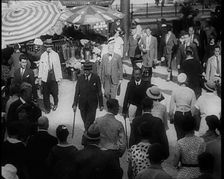 Crowd of Well Dressed People Walking Down the Pavement, 1933. Creator: British Pathe Ltd