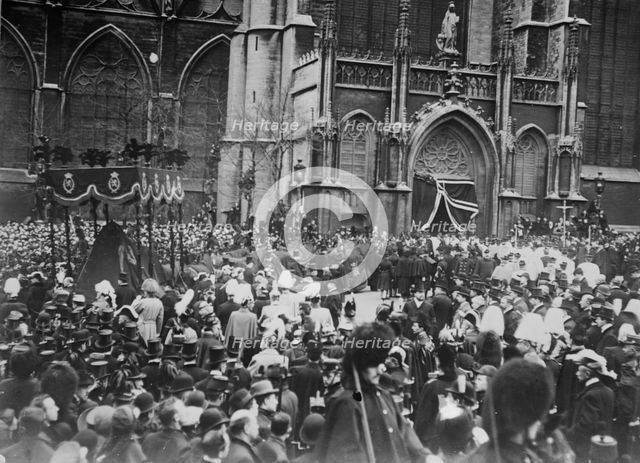 Crowd outside church allowing funeral cortege of King Leopold to pass, Belgium, 1910. Creator: Bain News Service.
