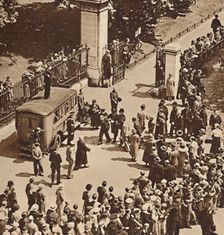 Crowd watches the arrested man taken to police van 1937. Creator: Unknown