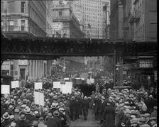 Crowd Walking Parading Down a Road and Holding Signs, 1933. Creator: British Pathe Ltd