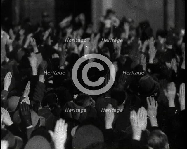 Crowd With Right Arms Raised in a Nazi Salute in the Direction of the..., 1937. Creator: British Pathe Ltd.