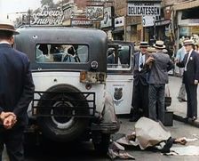 Crowded New York City Street Where Police and Ambulance Attend to Dead and Dying Victims..., 1932. Creator: British Pathe Ltd