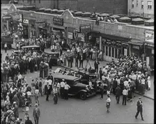 Crowded New York City Street Where Police and Ambulance Attend to Dead and Dying Victims..., 1932. Creator: British Pathe Ltd