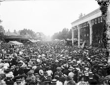 Crowded street showing a stage and carousel at St Giles Fair, Oxford, Oxfordshire, c1860-c1922. Artist: Henry Taunt