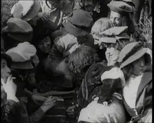 Crowds of Female Actors Wearing Period Costumes Smoking Cigarettes Whilst Filming..., 1920s. Creator: British Pathe Ltd