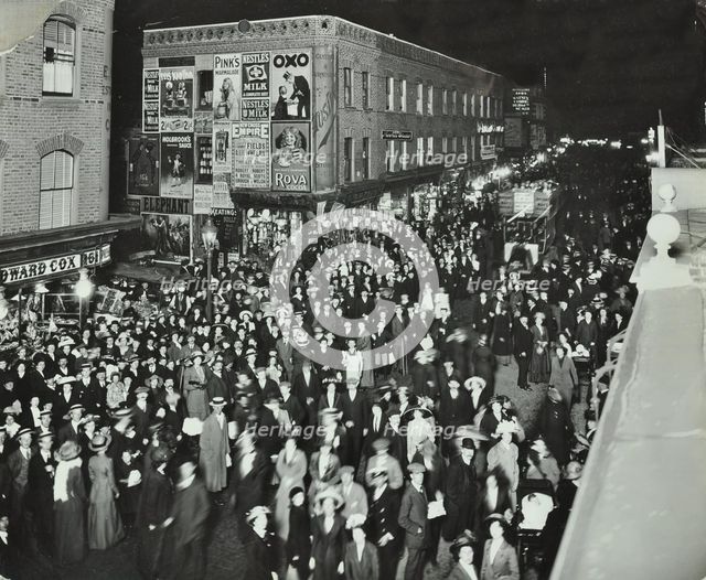 Crowds of shoppers in Rye Lane at night, Peckham, London, 1913. Artist: Unknown.