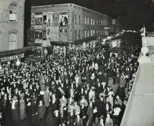 Crowds of shoppers in Rye Lane at night, Peckham, London, 1913