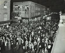 Crowds of shoppers in Rye Lane at night, Peckham, London, 1913