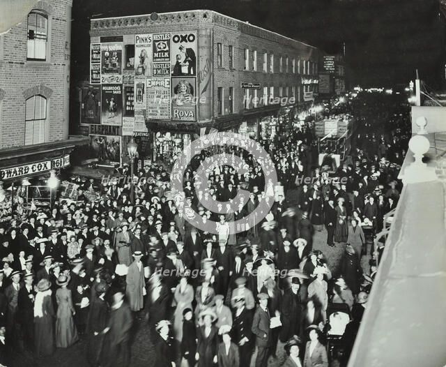 Crowds of shoppers in Rye Lane at night, Peckham, London, 1913. Artist: Unknown.