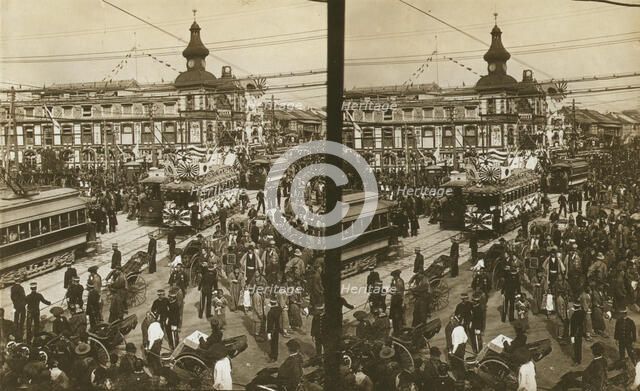 Crowds on a Tokyo street, near the train station(?), during the celebration of Admiral..., c1905. Creator: Underwood & Underwood.
