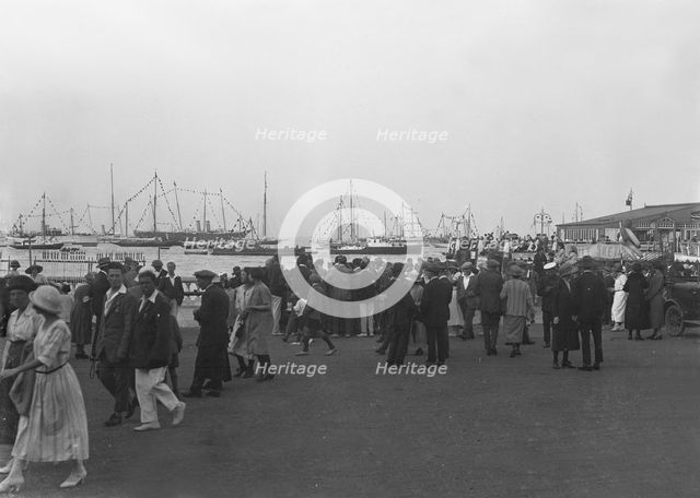 Crowds on the water front during a regatta, c1930. Creator: Kirk & Sons of Cowes.