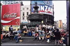Crowds on the steps at the base of the Shaftesbury Memorial Fountain, Piccadilly Circus, 1974. Creator: Dorothy Chapman