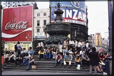 Crowds on the steps at the base of the Shaftesbury Memorial Fountain, Piccadilly Circus, 1974. Creator: Dorothy Chapman