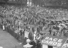 Crowds attending a motor race at Brooklands. Artist: Bill Brunell