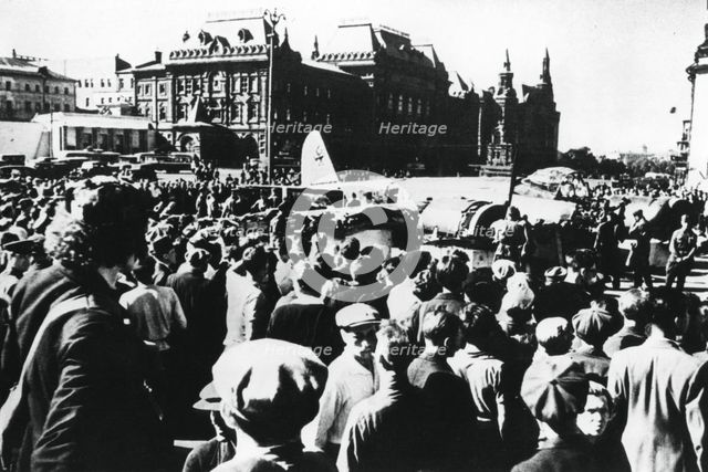 Crowds around a downed German bomber on display in Sverdlov Square, Moscow, 1941. Artist: Unknown