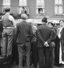 Crowds around post office, Lower East Side, New York, 1936. Creator: Dorothea Lange