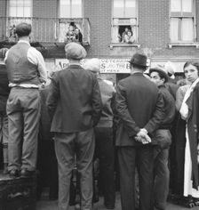 Crowds around post office, Lower East Side, New York, 1936. Creator: Dorothea Lange