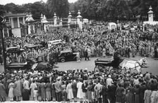 Crowds gathered outside Buckingham Palace a few days before the coronation, 1953