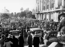 Crowds in the street for the Monte Carlo Rally, 1930. Artist: Bill Brunell