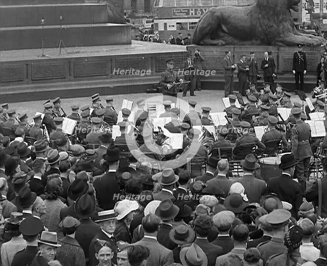 Crowds Listening to a Brass Band in Trafalgar Square, 1940. Creator: British Pathe Ltd.