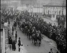 Crowds Stand by and Cheer as King George V and Queen Mary of The United Kingdom Ride in a..., 1924. Creator: British Pathe Ltd