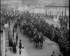 Crowds Stand by and Cheer as King George V and Queen Mary of The United Kingdom Ride in a..., 1924. Creator: British Pathe Ltd