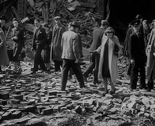 Crowds Walking Past Bombed Out Buildings, 1940. Creator: British Pathe Ltd