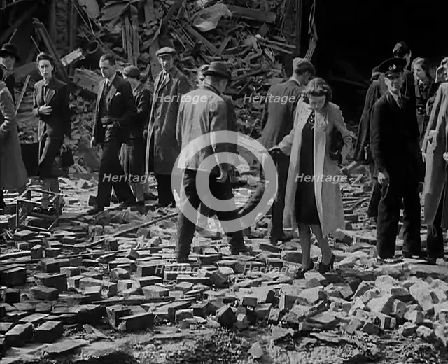 Crowds Walking Past Bombed Out Buildings, 1940. Creator: British Pathe Ltd.